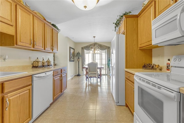 1101 Timberwood, Chippewa Twp, PA 15010 - kitchen with white appliances, a chandelier, light tile patterned flooring, and light countertops