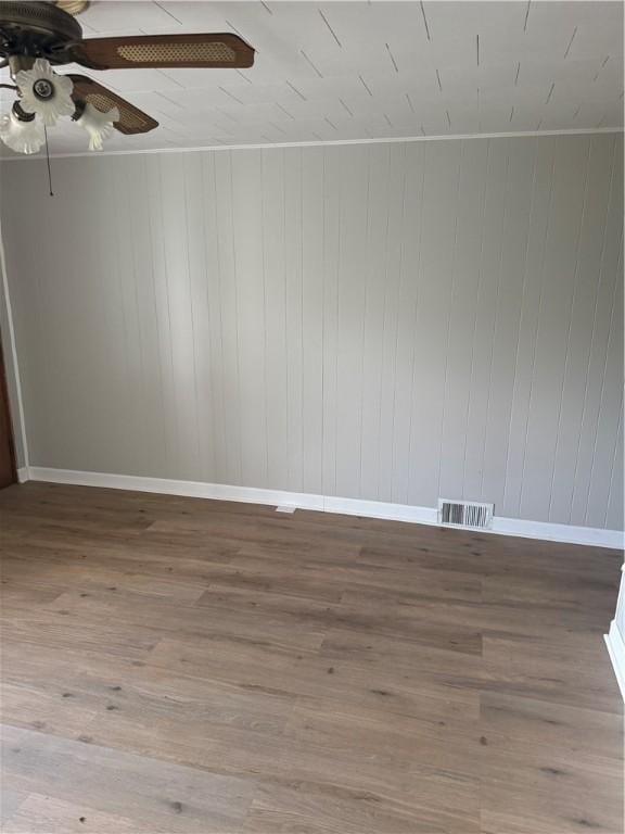 965 Leeds, Monessen, PA 15062 - unfurnished room with a ceiling fan, wood finished floors, and wooden walls