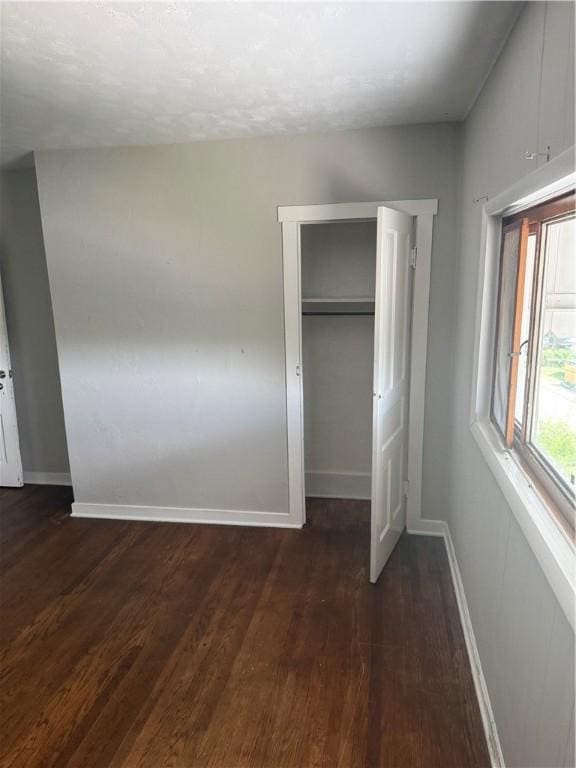 965 Leeds, Monessen, PA 15062 - unfurnished bedroom with dark wood-style floors and a closet