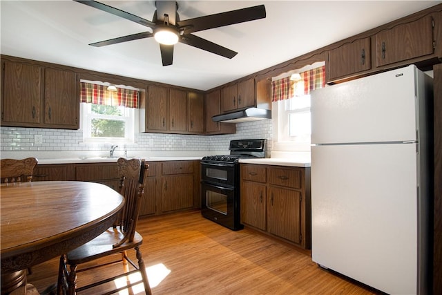 963 Herman Rd, Summit Twp, PA 16002 - kitchen featuring freestanding refrigerator, range with two ovens, light countertops, and backsplash