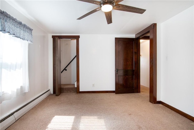 963 Herman Rd, Summit Twp, PA 16002 - unfurnished bedroom with baseboard heating, light colored carpet, and ceiling fan