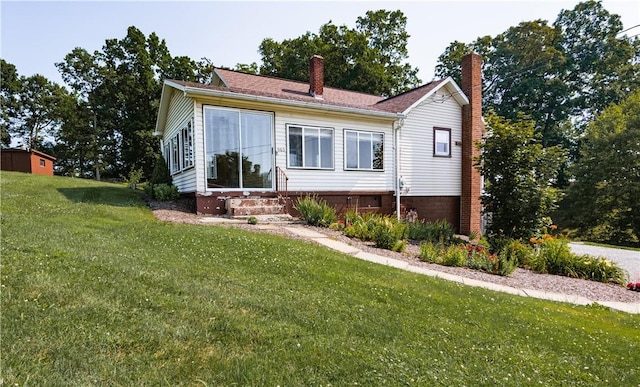 963 Herman Rd, Summit Twp, PA 16002 - view of front facade featuring entry steps, a front yard, and a chimney
