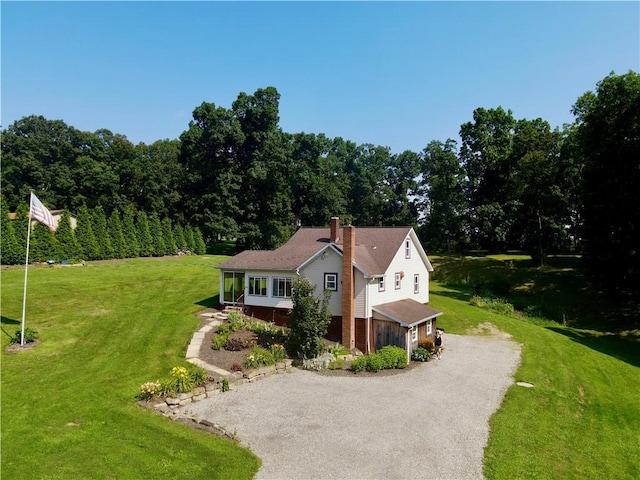 963 Herman Rd, Summit Twp, PA 16002 - view of front facade with driveway, a chimney, and a front yard
