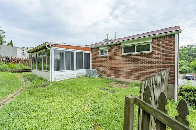 127 Mardi Gras Dr, Plum Boro, PA 15239 - back of house with a sunroom and brick siding
