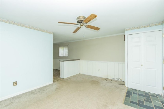 127 Mardi Gras Dr, Plum Boro, PA 15239 - empty room featuring ceiling fan, carpet, crown molding, and a wainscoted wall