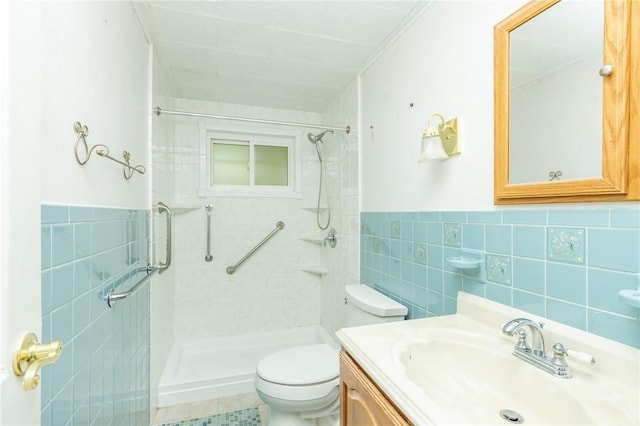 127 Mardi Gras Dr, Plum Boro, PA 15239 - bathroom with tile walls, a shower stall, vanity, and a wainscoted wall