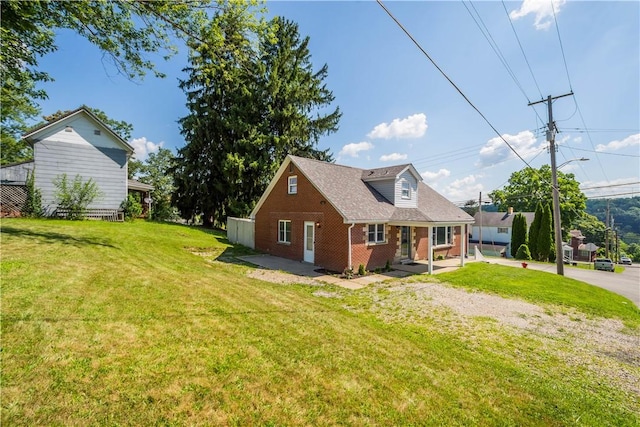 57 Welcome St, East Bethlehem, PA 15333 - view of front of home with brick siding and a front yard