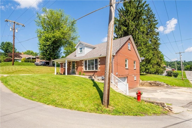 57 Welcome St, East Bethlehem, PA 15333 - new england style home featuring brick siding, a front lawn, and driveway