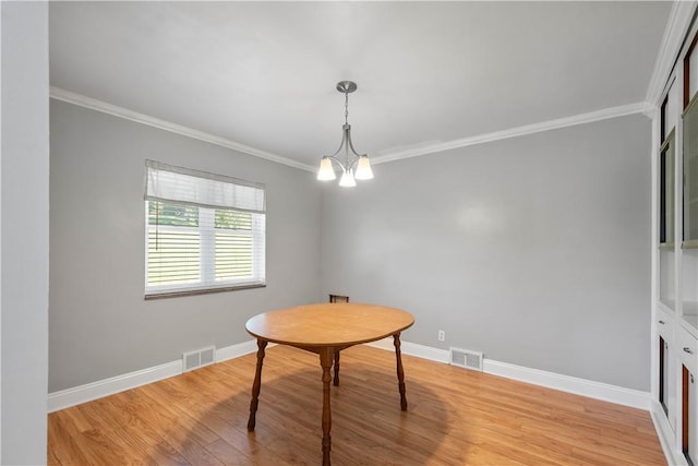 57 Welcome St, East Bethlehem, PA 15333 - dining room featuring ornamental molding, light wood-style flooring, and a chandelier