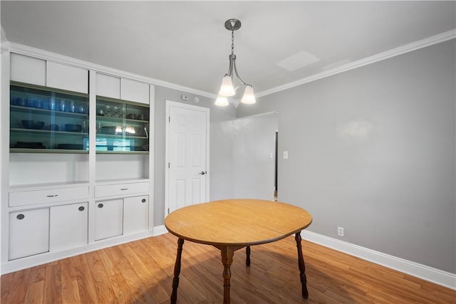 57 Welcome St, East Bethlehem, PA 15333 - dining area featuring light wood finished floors and crown molding