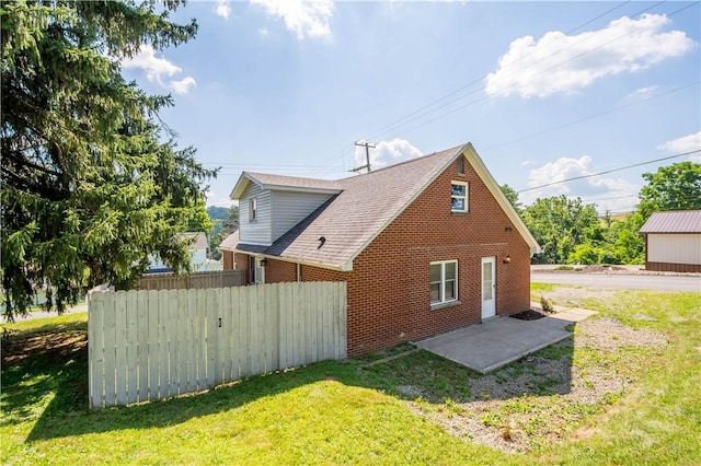 57 Welcome St, East Bethlehem, PA 15333 - view of home's exterior featuring roof with shingles and brick siding