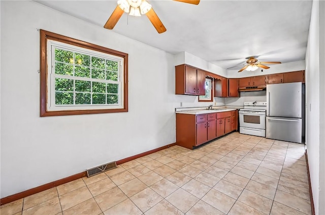 129 Shenango Park Rd, Pymatuning Twp, PA 16154 - kitchen with a ceiling fan, freestanding refrigerator, white range with electric stovetop, light countertops, and light tile patterned floors