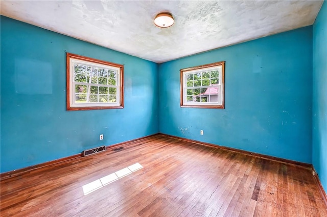 129 Shenango Park Rd, Pymatuning Twp, PA 16154 - spare room with wood-type flooring and baseboards