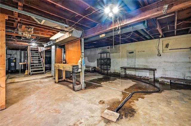 129 Shenango Park Rd, Pymatuning Twp, PA 16154 - unfinished basement featuring stairway and water heater
