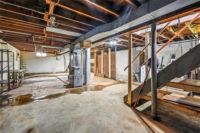 129 Shenango Park Rd, Pymatuning Twp, PA 16154 - unfinished basement featuring stairs and heating unit