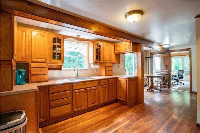 385 Wallace Run Rd, Big Beaver, PA 15010 - kitchen with dark wood-type flooring, light countertops, glass insert cabinets, and brown cabinets