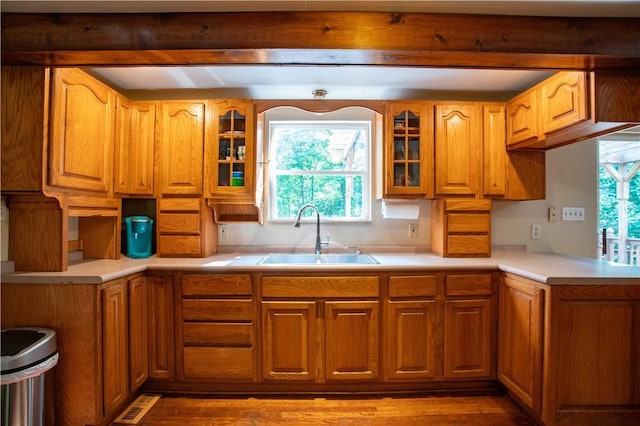 385 Wallace Run Rd, Big Beaver, PA 15010 - kitchen featuring glass insert cabinets, wood finished floors, light countertops, and brown cabinets