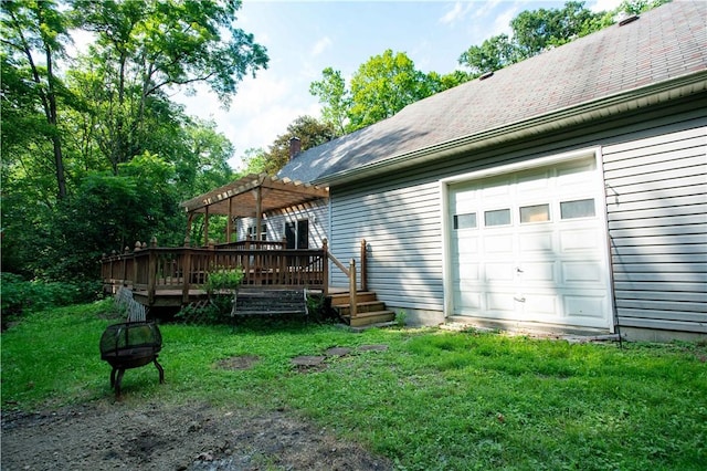 385 Wallace Run Rd, Big Beaver, PA 15010 - rear view of house with a pergola, a garage, a deck, a fire pit, and a lawn