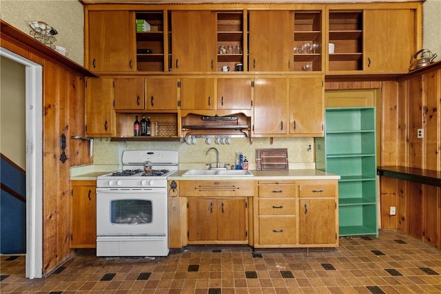 827 Beaver Rd, Ambridge, PA 15003 - kitchen with open shelves, gas range gas stove, light countertops, wood walls, and decorative backsplash