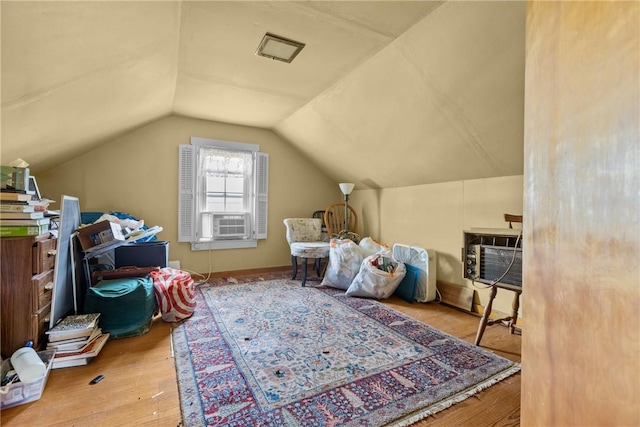 827 Beaver Rd, Ambridge, PA 15003 - additional living space with vaulted ceiling, wood finished floors, and an AC wall unit
