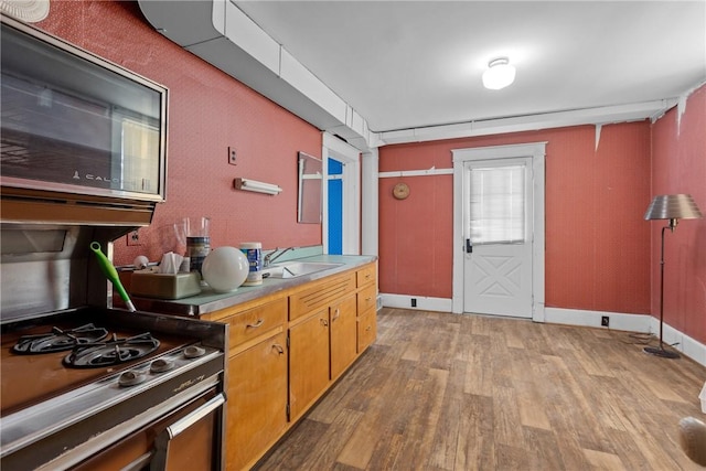827 Beaver Rd, Ambridge, PA 15003 - kitchen with light wood finished floors, range, and light countertops