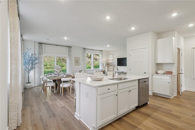 130 River Ridge Drive, Moon/Crescent Twp, PA 15108 - kitchen with light wood-style floors, white cabinets, recessed lighting, and light countertops