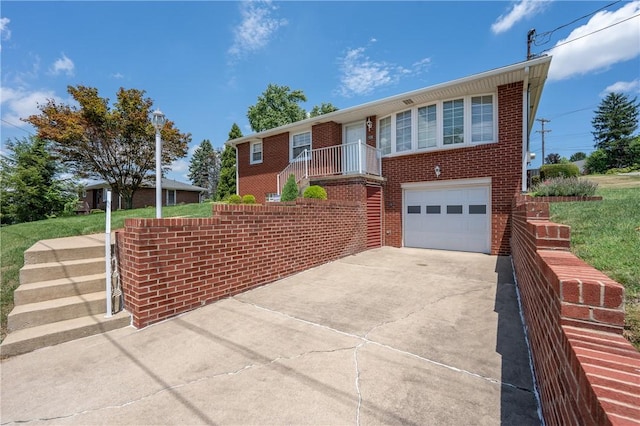 1936 Sylvan Ave, Latrobe, PA 15650 - ranch-style home with concrete driveway, an attached garage, and brick siding