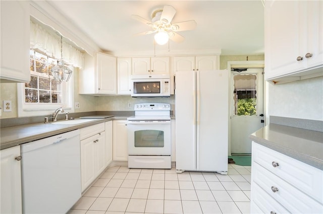 1936 Sylvan Ave, Latrobe, PA 15650 - kitchen featuring white appliances, white cabinets, ceiling fan, and light tile patterned floors