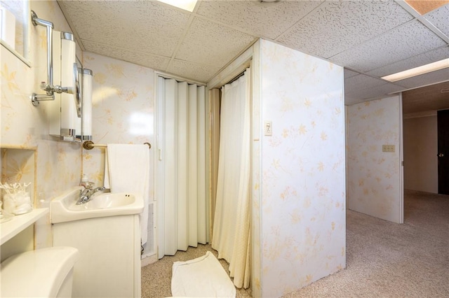 1936 Sylvan Ave, Latrobe, PA 15650 - bathroom featuring wallpapered walls, a drop ceiling, and vanity