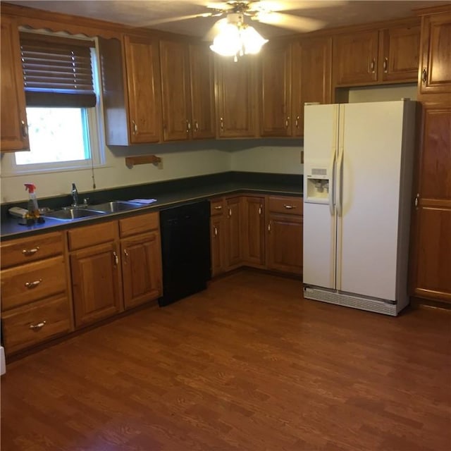 1216-1218 Clark St Unit 1216, White Oak, PA 15131 - kitchen with white refrigerator with ice dispenser, dark countertops, brown cabinetry, dishwasher, and dark wood finished floors