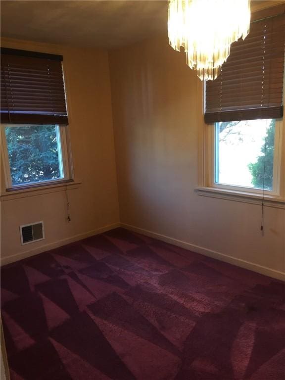 1216-1218 Clark St Unit 1216, White Oak, PA 15131 - empty room with carpet flooring and a chandelier