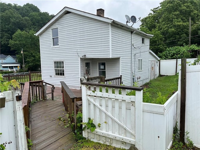 402 N 10th St, Apollo Boro, PA 15613 - back of property with a chimney and a wooden deck