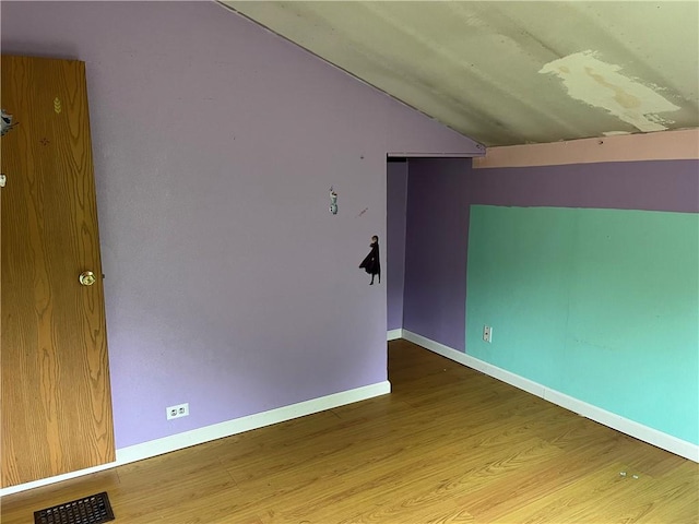 402 N 10th St, Apollo Boro, PA 15613 - unfurnished room featuring lofted ceiling and wood finished floors