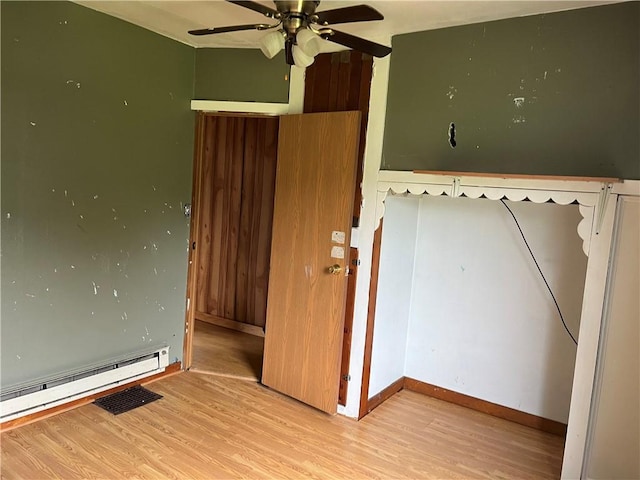 402 N 10th St, Apollo Boro, PA 15613 - unfurnished bedroom featuring wood finished floors and a baseboard radiator