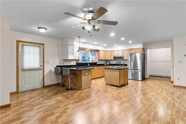 178 Christopher, Christopher, PA 16640 - kitchen with light wood finished floors, appliances with stainless steel finishes, dark countertops, recessed lighting, and a ceiling fan