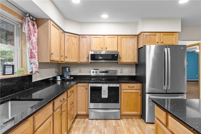 178 Christopher, Christopher, PA 16640 - kitchen featuring appliances with stainless steel finishes, light wood-type flooring, dark stone counters, and recessed lighting
