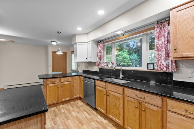 178 Christopher, Christopher, PA 16640 - kitchen featuring a peninsula, stainless steel dishwasher, dark stone counters, a baseboard heating unit, and light wood-type flooring