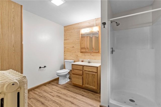 178 Christopher, Christopher, PA 16640 - bathroom with wood walls, a stall shower, vanity, and wood finished floors