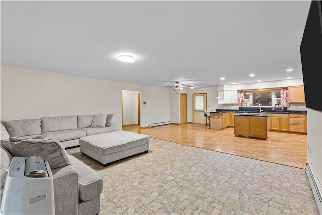 178 Christopher, Christopher, PA 16640 - living room featuring light stone finish flooring, a baseboard heating unit, a ceiling fan, and recessed lighting