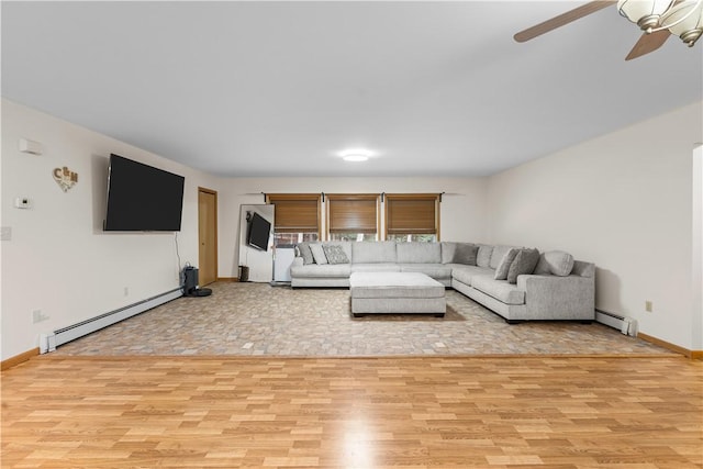 178 Christopher, Christopher, PA 16640 - living area featuring light wood finished floors, a baseboard heating unit, and a ceiling fan