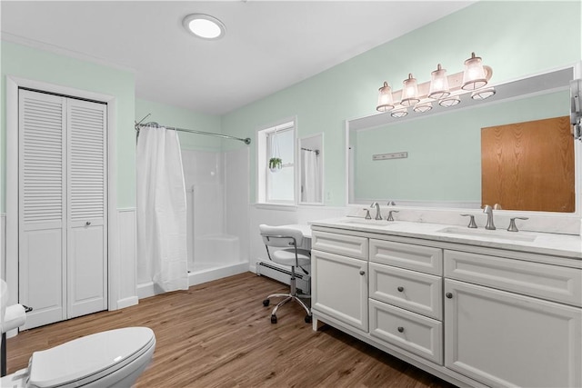 178 Christopher, Christopher, PA 16640 - full bathroom with a closet, double vanity, curtained shower, wood finished floors, and baseboard heating