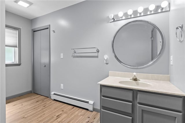 178 Christopher, Christopher, PA 16640 - bathroom featuring a baseboard heating unit, vanity, and wood finished floors