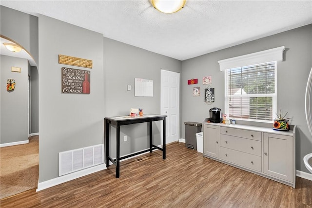 847 Sunset Cir, Cranberry Twp, PA 16066 - office space featuring arched walkways, light wood-style flooring, and a textured ceiling