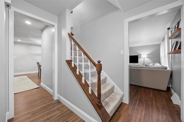 215 E Edgewood Dr, Peters Twp, PA 15317 - stairway featuring wood finished floors and recessed lighting