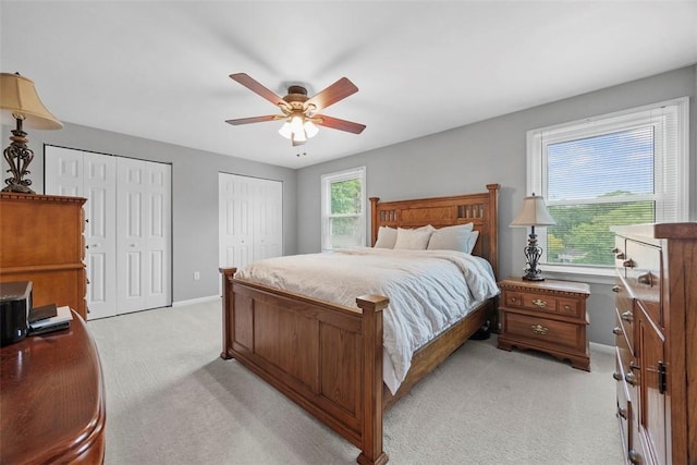 215 E Edgewood Dr, Peters Twp, PA 15317 - bedroom featuring light carpet, two closets, and a ceiling fan