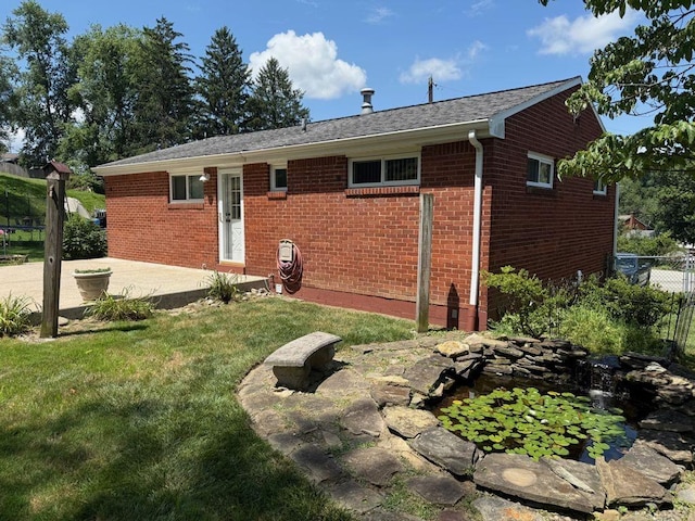 13901 Harvie Ct, North Huntingdon, PA 15642 - back of house with a patio and brick siding