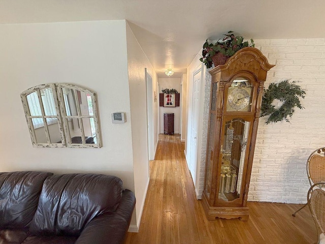 13901 Harvie Ct, North Huntingdon, PA 15642 - hall with light wood finished floors and brick wall
