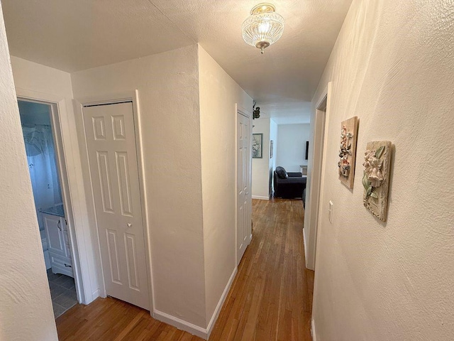 13901 Harvie Ct, North Huntingdon, PA 15642 - hall with wood finished floors and a textured wall