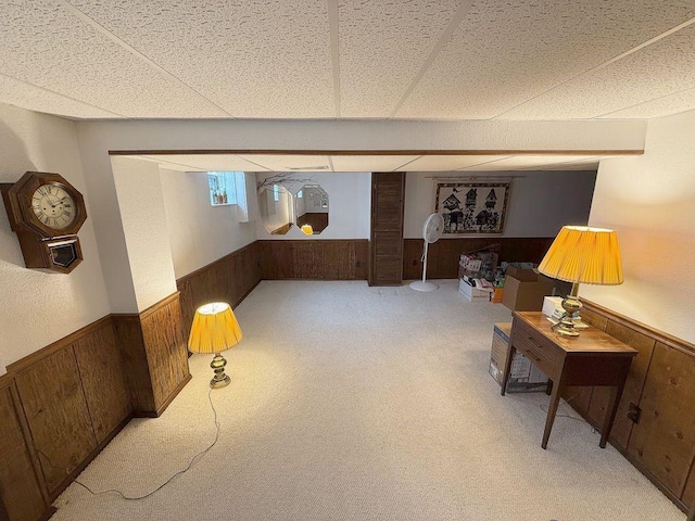 13901 Harvie Ct, North Huntingdon, PA 15642 - below grade area featuring a wainscoted wall, wood walls, and light carpet