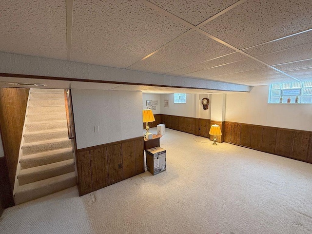 13901 Harvie Ct, North Huntingdon, PA 15642 - basement featuring wainscoting, wooden walls, stairs, and carpet flooring